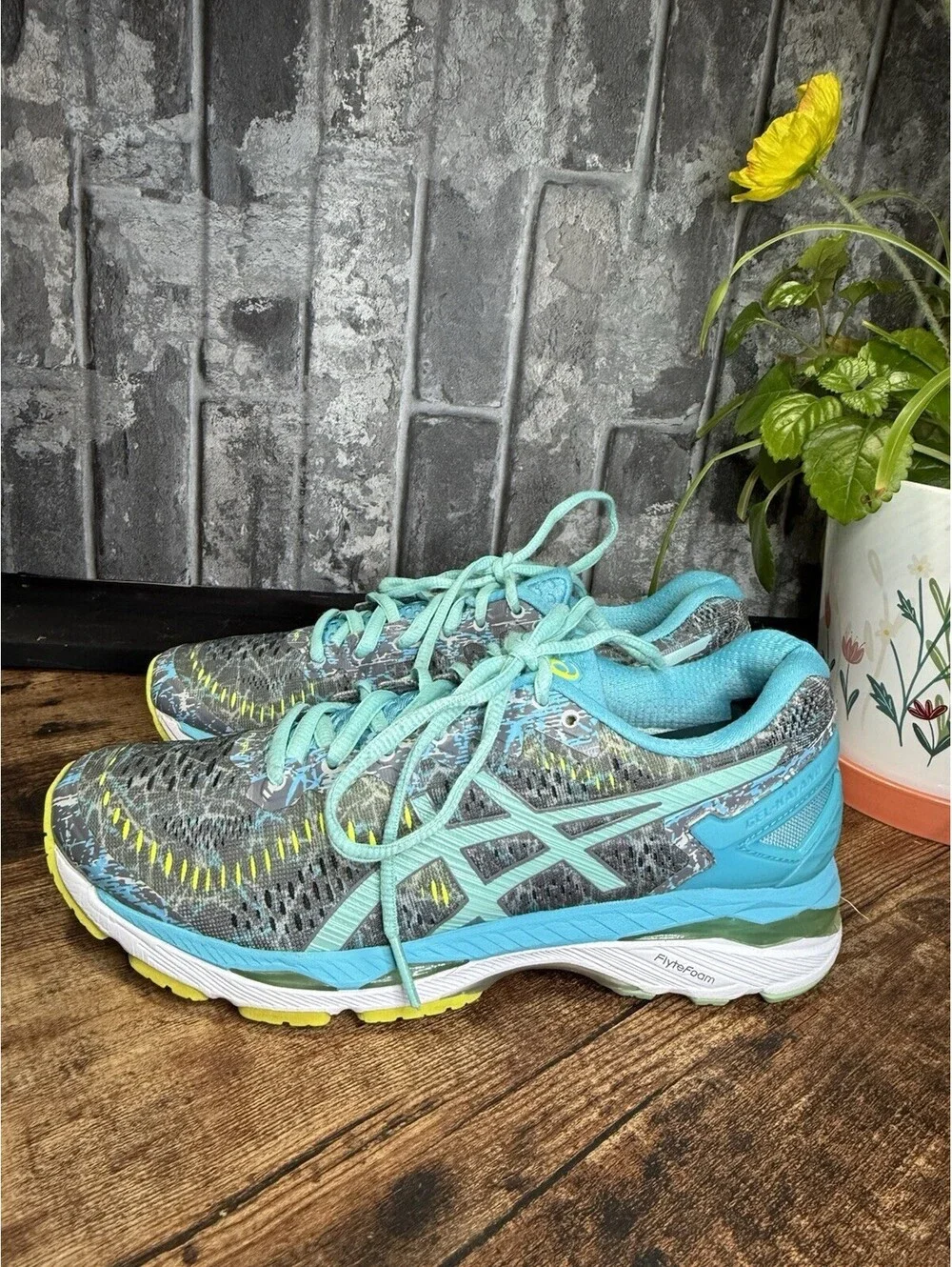 ASICS Gel-Kayano running shoes in a gray/blue/turquoise colorway, Women’s US 7.5